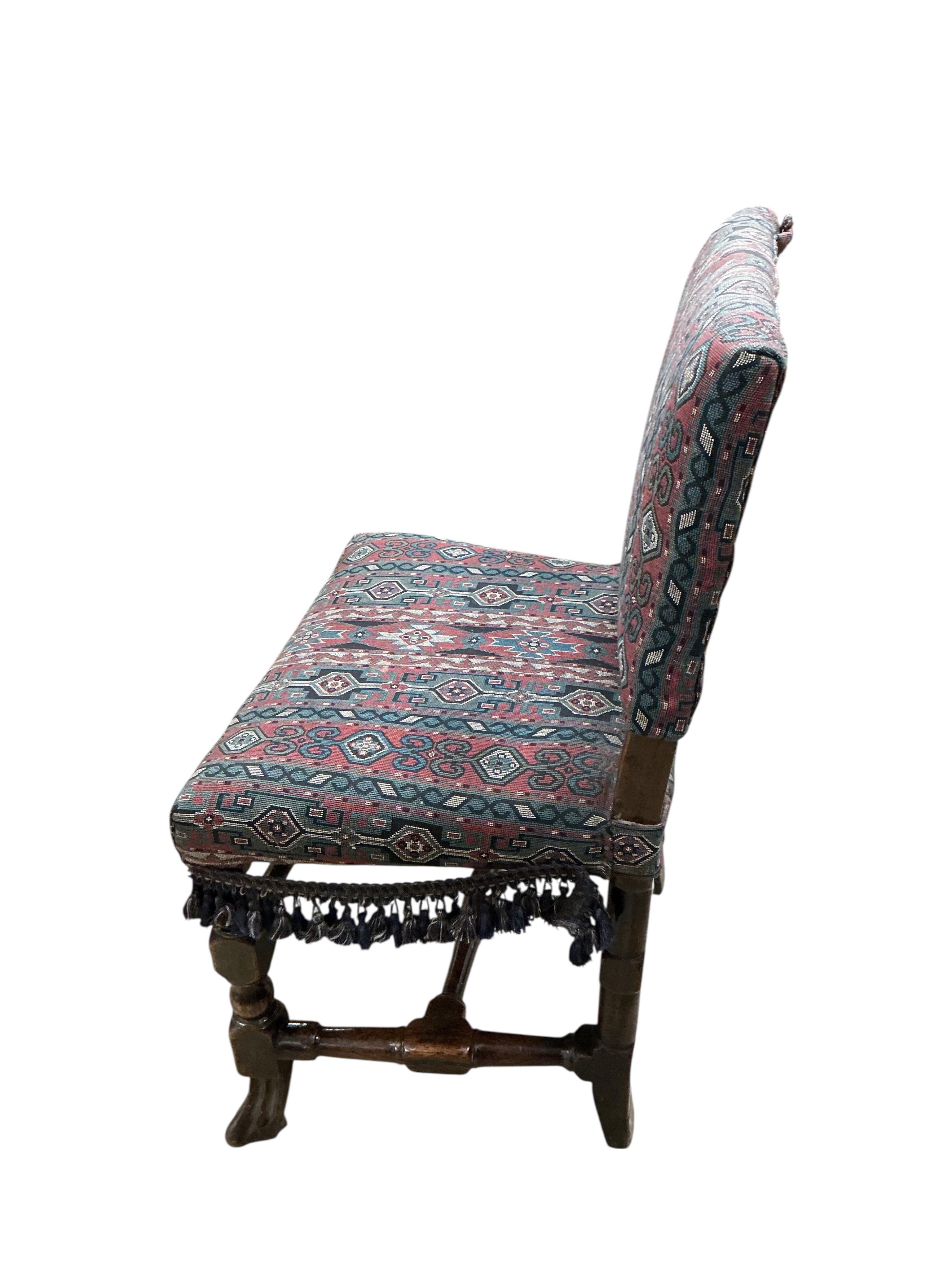A late 17th century oak side chair, with Soumak carpet upholstery, width 49cm, depth 40cm, height 84cm